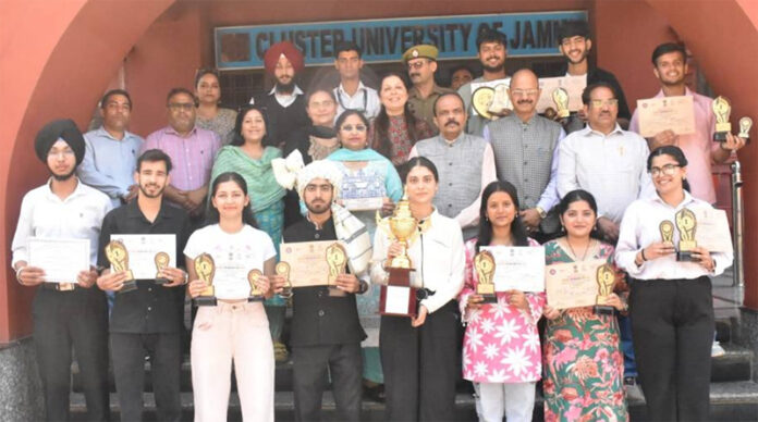 Outstanding achievers posing along with University Management.