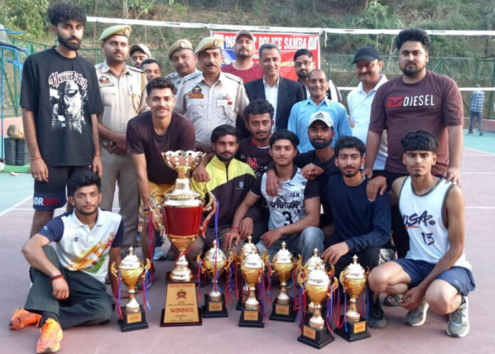 Winners of Volleyball tournament posing with police officers. Winners of Volleyball tournament posing with police officers.