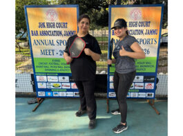 Pickleball players posing for photograph before match.