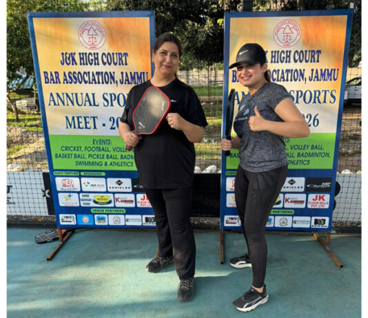 Pickleball players posing for photograph before match.