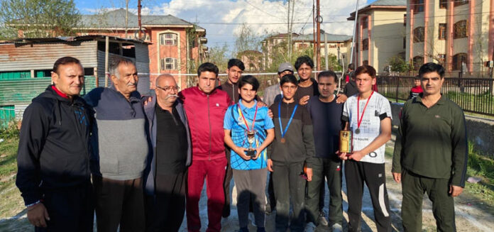 Winners of Badminton Tournament posing with senior citizens. Winners of Badminton Tournament posing with senior citizens.