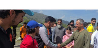 Dignitary interacting with players during inaugural event.