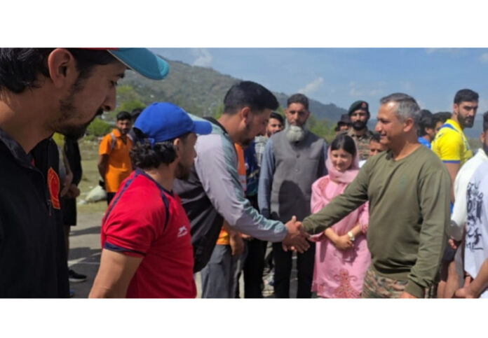 Dignitary interacting with players during inaugural event.