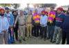 Dignitaries posing along with cricketer Yudhvir Singh Charak during a programme.