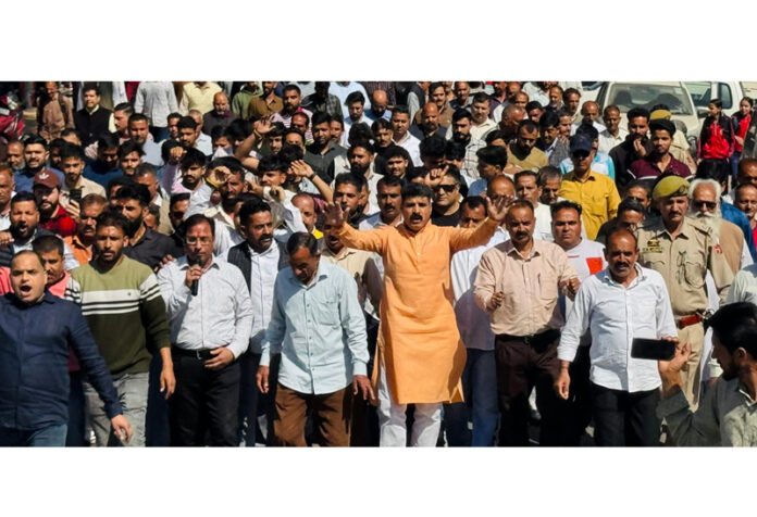 Locals up in arms against dilapidated condition of Udhampur-Billawar road at Manwal Bus Stand. Locals up in arms against dilapidated condition of Udhampur-Billawar road at Manwal Bus Stand.