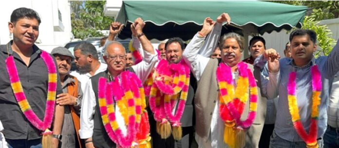 Ex-Minister Ch Gharu Ram being welcomed into Cong fold by JKPCC chief TH Karra in Jammu.