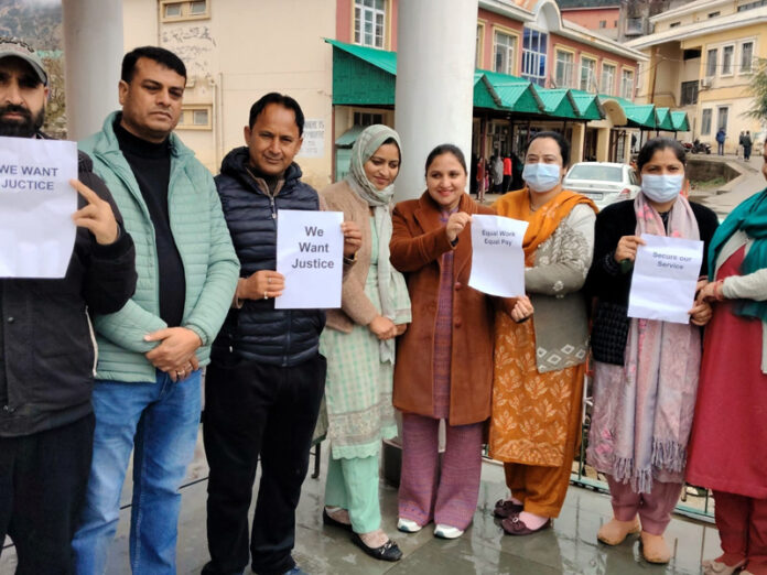 NHM employees highlighting their demands during their pen-down strike on Monday.
