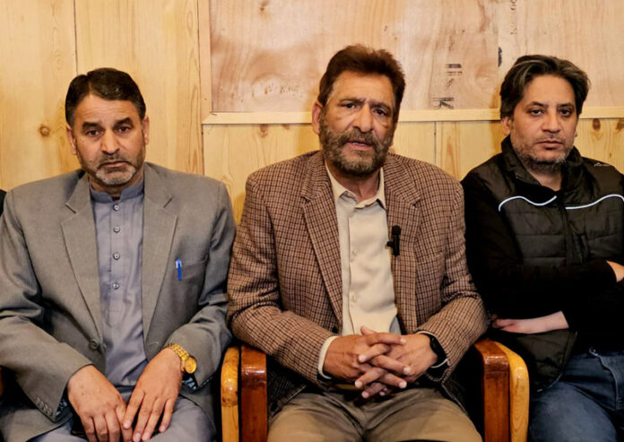 PDP spokesperson Iqbal Tramboo alongwith other party leaders during a press conference in Srinagar on Monday. -Excelsior/Shakeel