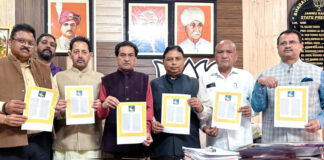 Sat Sharma, president J&K BJP and MP (RS) releasing teachings of Guru Ravi Dass compiled by Balbir Ram Rattan at Jammu on Saturday.