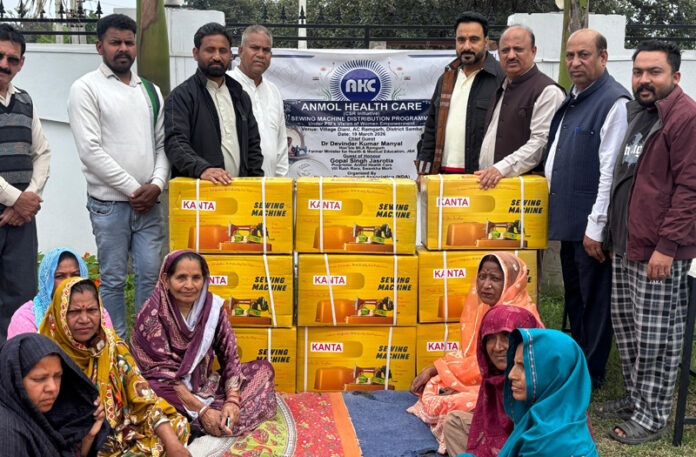 MLA Dr Devinder Kumar Manyal distributing sewing machines during a function in Ramgarh.