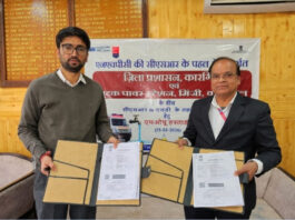 Officials of NHPC and Kargil District Administration signing MoU on Wednesday. -Excelsior/Basharat Ladakhi