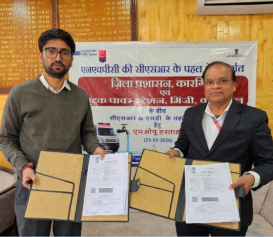 Officials of NHPC and Kargil District Administration signing MoU on Wednesday. -Excelsior/Basharat Ladakhi