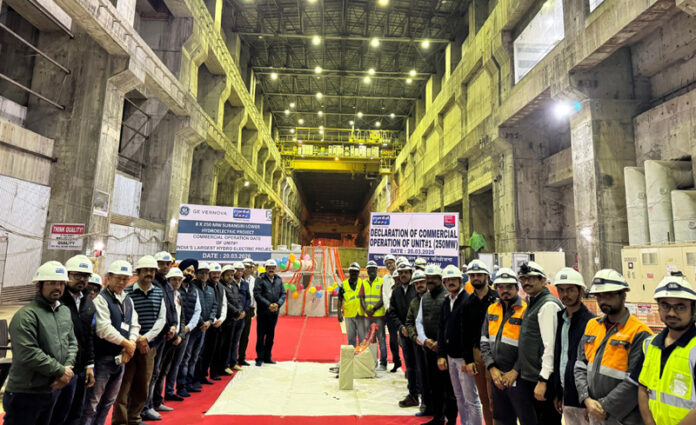 NHPC officials posing on the commissioning of third unit of Subansiri Lower Hydroelectric Project.