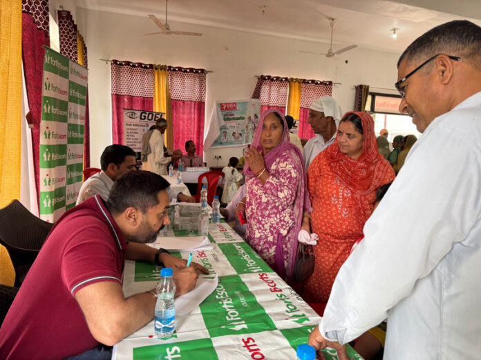 Doctors checking the patients during a medical camp organized in Ramgarh. Doctors checking the patients during a medical camp organized in Ramgarh.