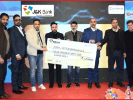 Dignitaries from J&K Bank handing over a cheque to a beneficiary in Baramulla district on Wednesday.