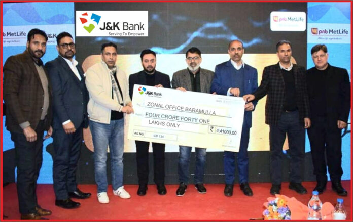 Dignitaries from J&K Bank handing over a cheque to a beneficiary in Baramulla district on Wednesday. Dignitaries from J&K Bank handing over a cheque to a beneficiary in Baramulla district on Wednesday.