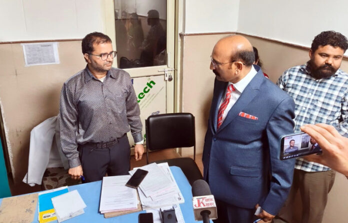 MLA Mohan Lal passing instructions to a doctor at SDH Akhnoor on Monday.