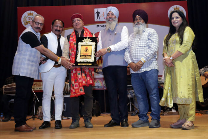 Chander Shekhar Bunty receiving an award on Monday.