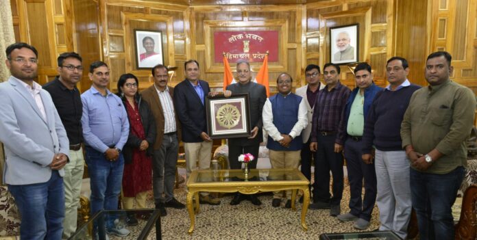 Governor Kavinder Gupta posing with a delegation on Monday.