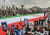 As other Iran-allied groups are engaging in  the Mideast war, Yemen's Houthis hold back