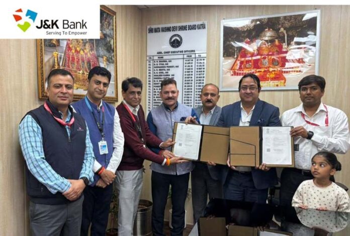 Dignitaries from Shri Mata Vaishno Devi Shrine Board and J&K Bank signing an MoU in Jammu on Wednesday.