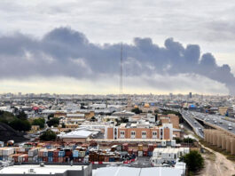 Smoke rises from Kuwait international airport after a drone strike on fuel storage in Kuwait City on Wednesday.