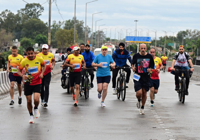 CM Omar Abdullah participating in Half Marathon in Jammu on Sunday morning. -Excelsior/Rakesh
