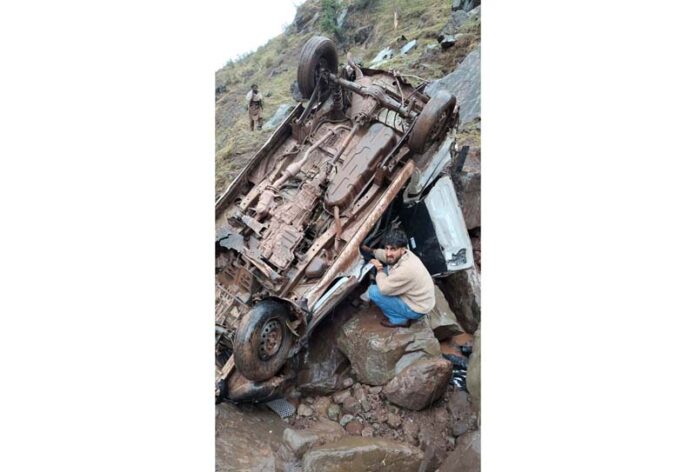 Wreckage of car lying in gorge after accident. -Excelsior/Romesh Mengi