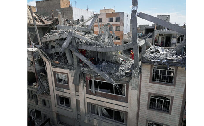 A residential building damaged by a strike in Tehran on Friday. A residential building damaged by a strike in Tehran on Friday.