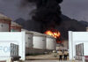 Fire and smoke rise in the Fujairah oil industry zone, caused by debris after interception of a drone by air defenses in UAE on Thursday.