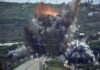 Smoke and flames rise from an Israeli airstrike that hit the Qasmiyeh Bridge near the coastal city of Tyre, Lebanon
