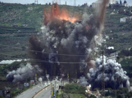 Smoke and flames rise from an Israeli airstrike that hit the Qasmiyeh Bridge near the coastal city of Tyre, Lebanon