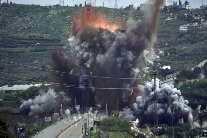 Smoke and flames rise from an Israeli airstrike that hit the Qasmiyeh Bridge near the coastal city of Tyre, Lebanon