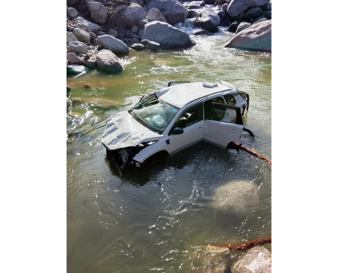 Remains of a car which fell into a rivulet in Bhaderwah on Friday. — Excelsior/Tilak Raj