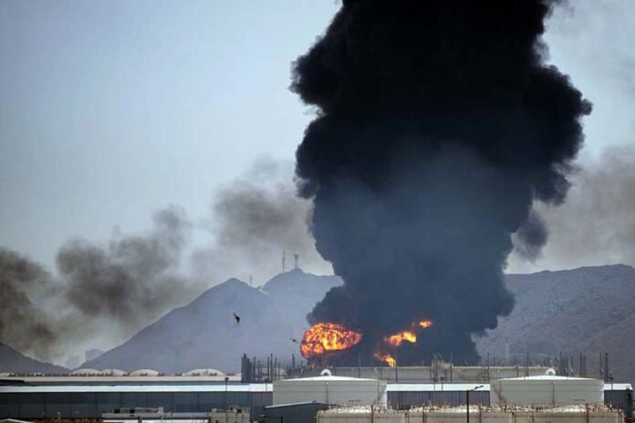 A fire and plume of smoke rise after, according to authorities. debris from an intercepted Iranian drone struck an oil facility in Fujairah, United Arab Emirates, Saturday.