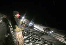 Army rescues stranded passengers at Sinthan Top on Sunday night.