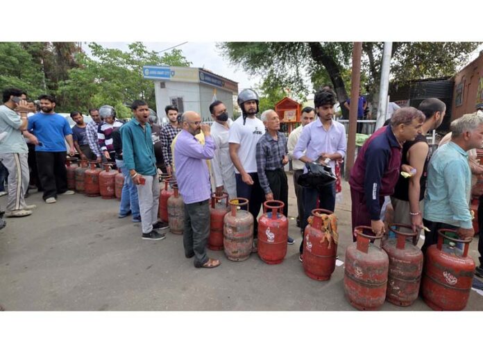 Long queue of people outside an LPG Agency in Jammu on Saturday. -Excelsior/Rakesh
