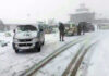 Vehicles trapped in snow at Peer Ki Gali on Mughal road on Sunday. —Excelsior/Imran