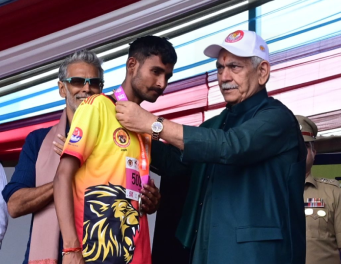 LG Manoj Sinha felicitating a winner of Jammu Marathon on Sunday.