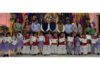 Students posing along with certificates during a programme.