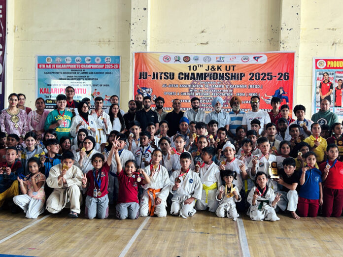 Athletes posing along with medals during closing ceremony.