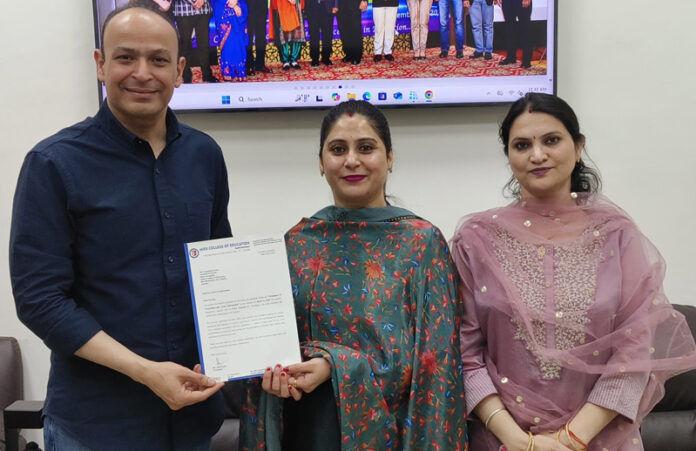 Prof. Adit Gupta presenting certificate to resource person at MIER College of Education, Jammu.