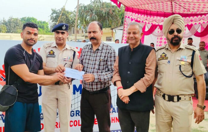 Dignitaries presenting an award to a player during the prize distribution ceremony.