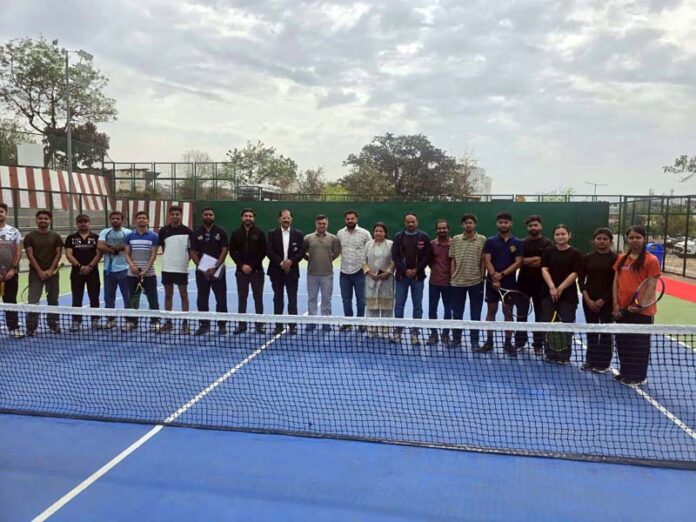 Players posing for a group photograph with officials. Players posing for a group photograph with officials.