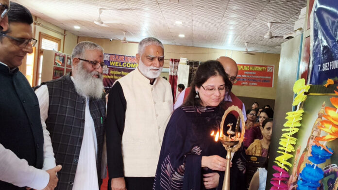Dignitaries lighting a lamp during a programme in Jammu on Monday.