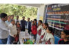 Dignitaries inspecting models during science exhibition.