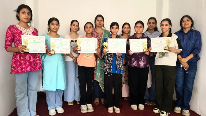 Participants posing along with certificates during a programme.