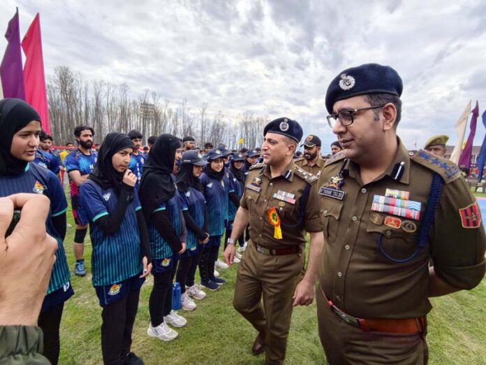 DIG North Kashmir Range Maqsood-ul-Zaman interacting with players during grand finale of sports activities under CAP.