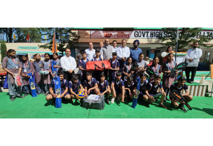 MLA Akhnoor, Mohan Lal Bhagat, with students during the sports kit distribution ceremony.