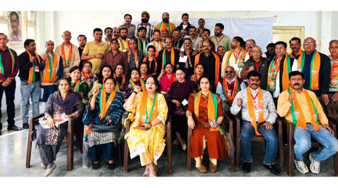 BJP leaders posing with party activists during concluding session of a Prashikshan camp in Jammu East Mandal.